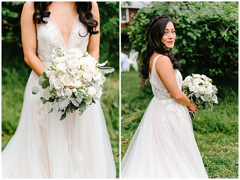 bride holding her white and greenery wedding bouquet