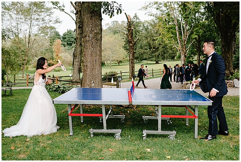 bride and groom playing ping pong before the wedding