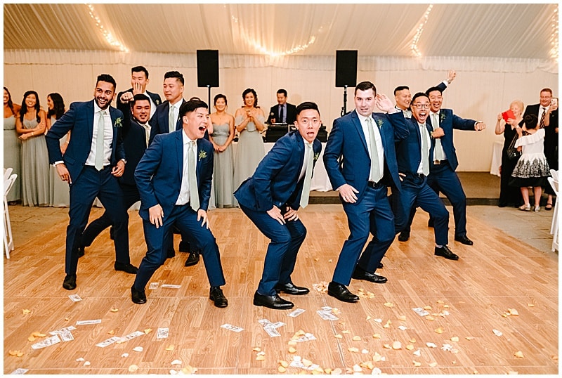 groomsmen dancing during the wedding reception