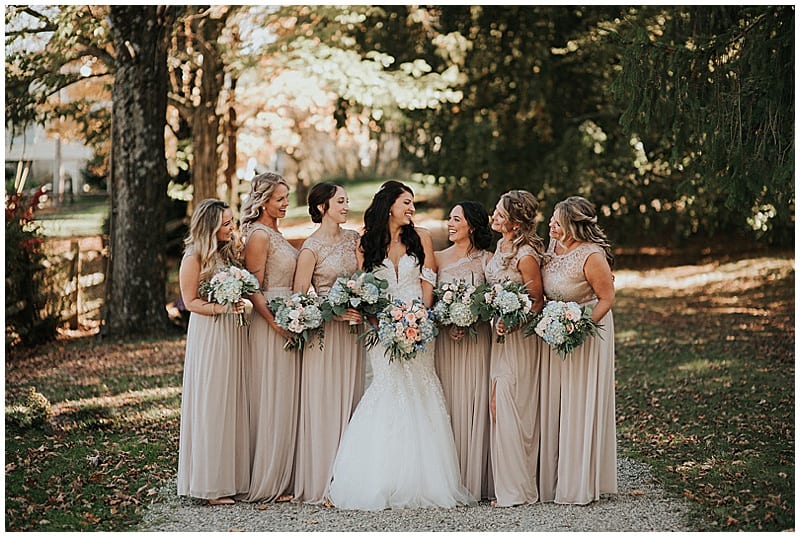 bride and bridesmaids holding their wedding bouquets
