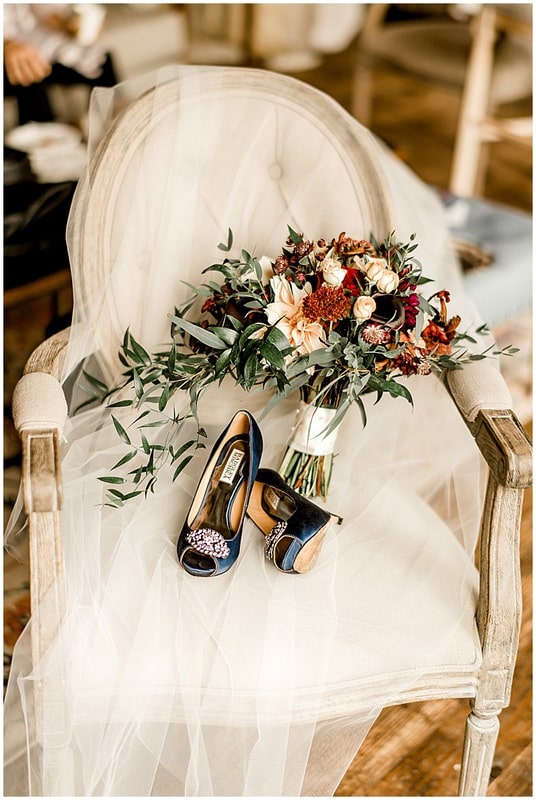 bride's wedding bouquet, wedding shoes, and veil