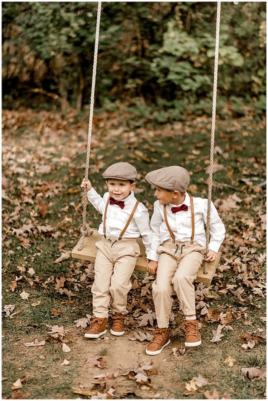 boys playing on the swing
