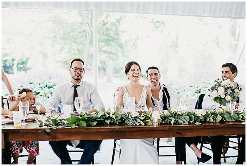head table with the bride and groom and bridal party