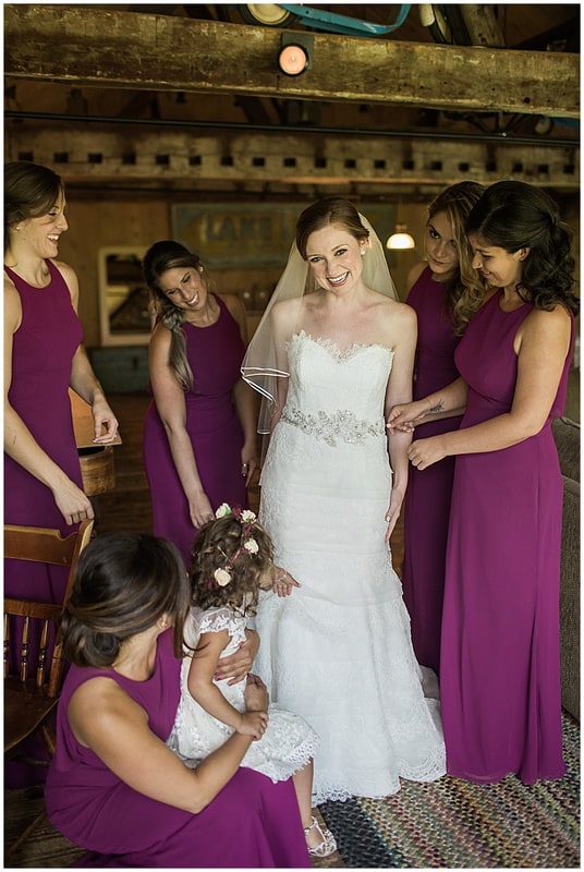 bride and her bridesmaids getting ready for her wedding