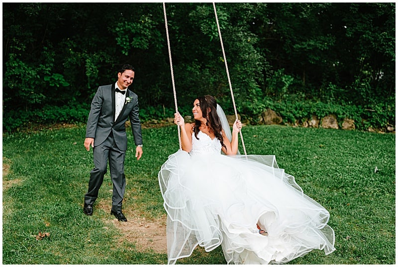 bride and groom by the swings