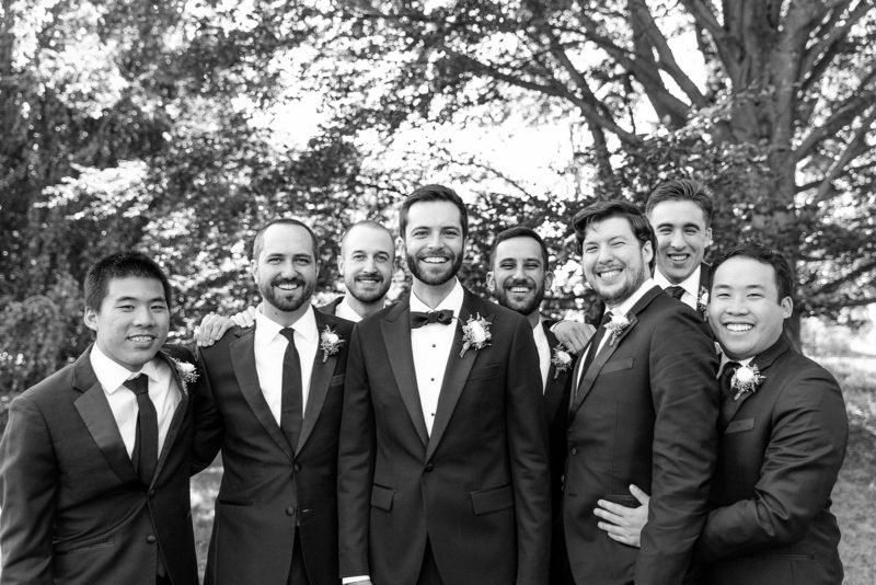 black and white image of a groom and his groomsmen
