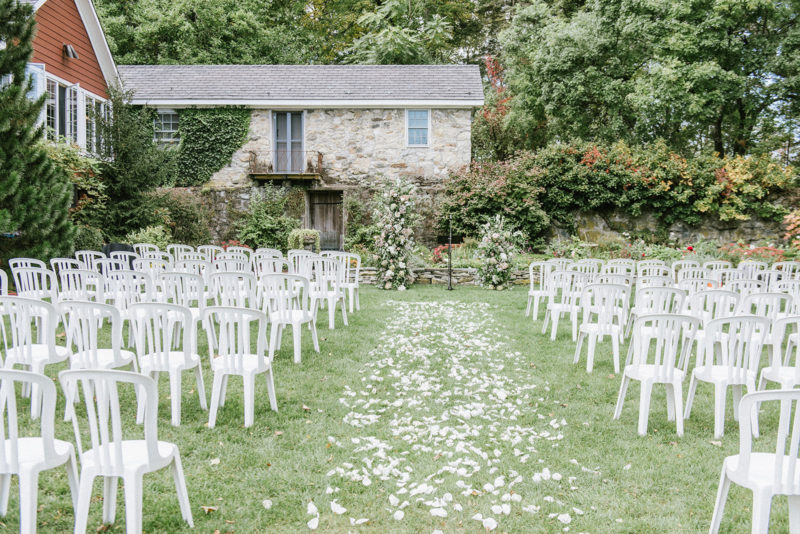wedding ceremony setup with flower petals leading up to the altar