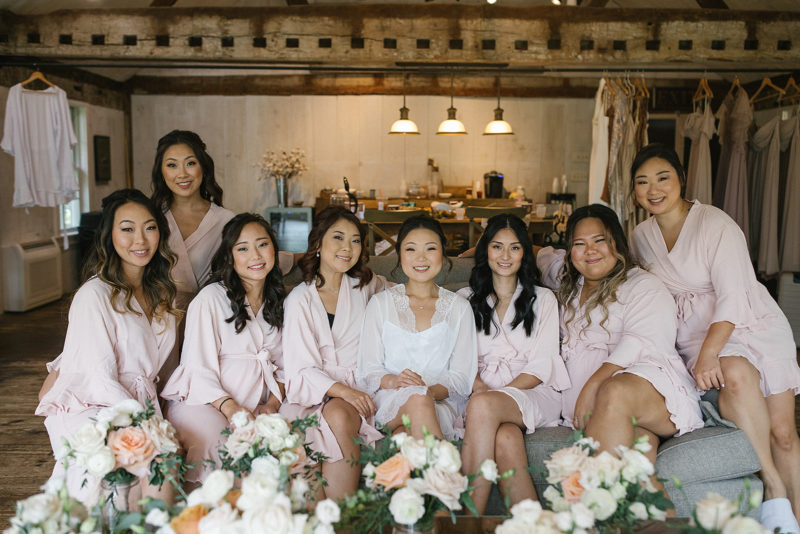bridesmaids sitting on the couch in the bridal suite