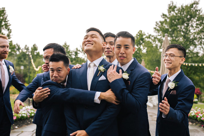 groomsmen posing for a funny picture