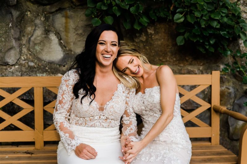 two brides posing together