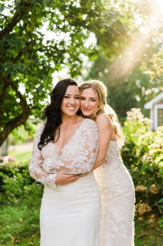 two brides posing together