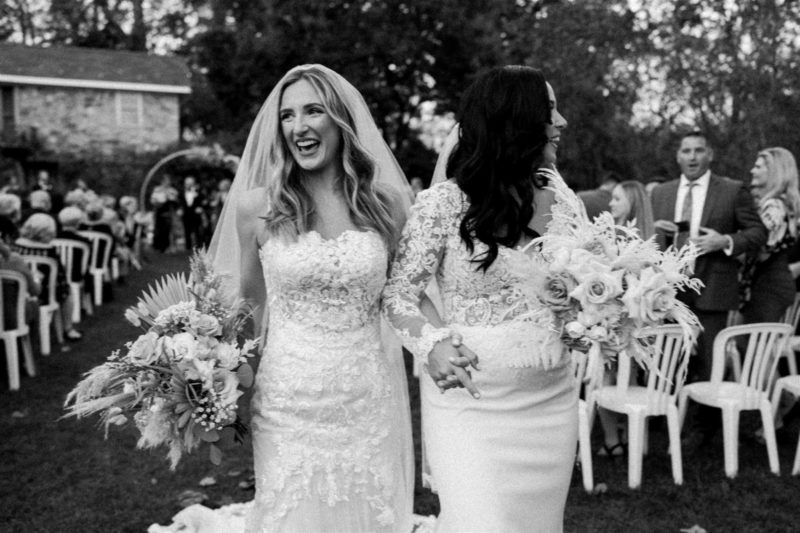 brides walking down the aisle after being married