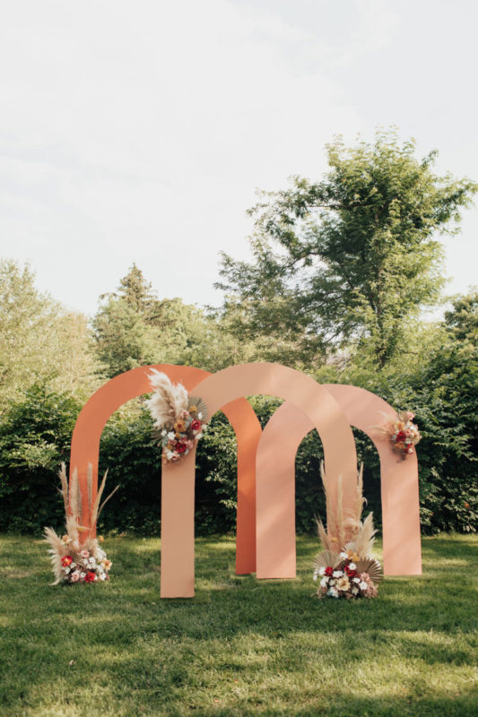 peach toned wedding arches for wedding ceremony