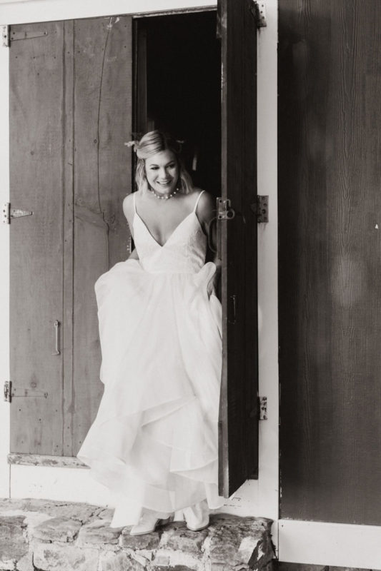 bride steps out of the bridal suite