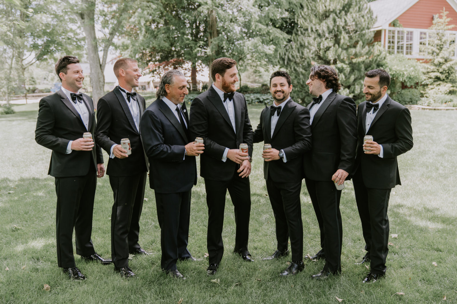 groom and groomsmen have a beer