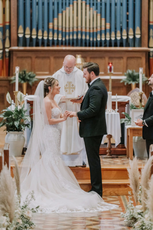 bride and groom meet at altar