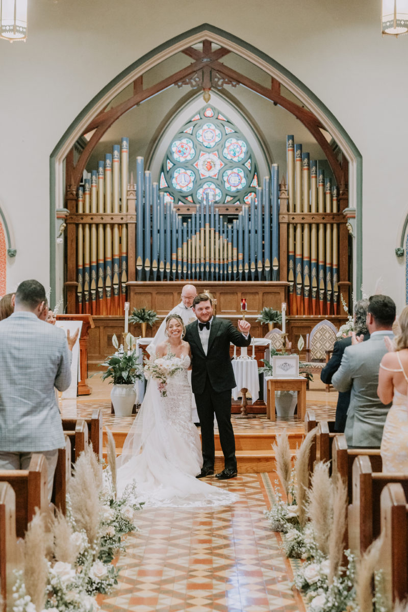 bride and groom at a church altar