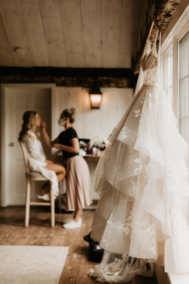 Bride getting her makeup done in the bridal suite