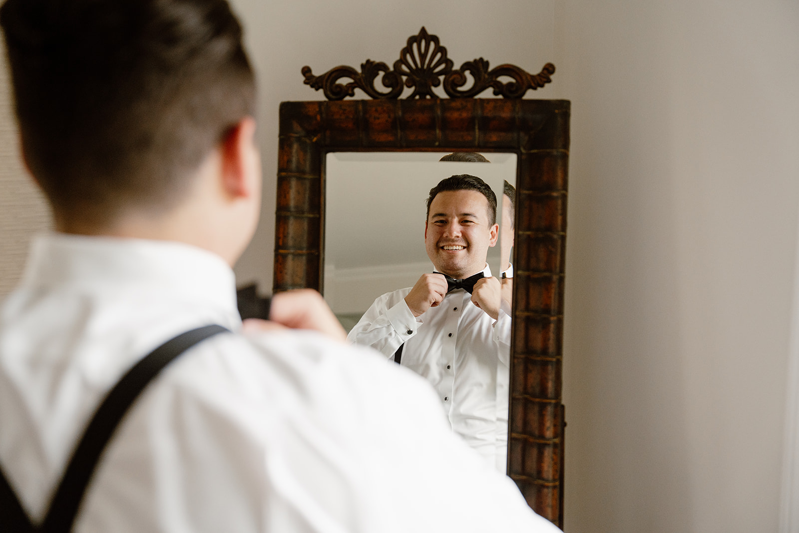 Groom getting ready in the Pequest Parlour