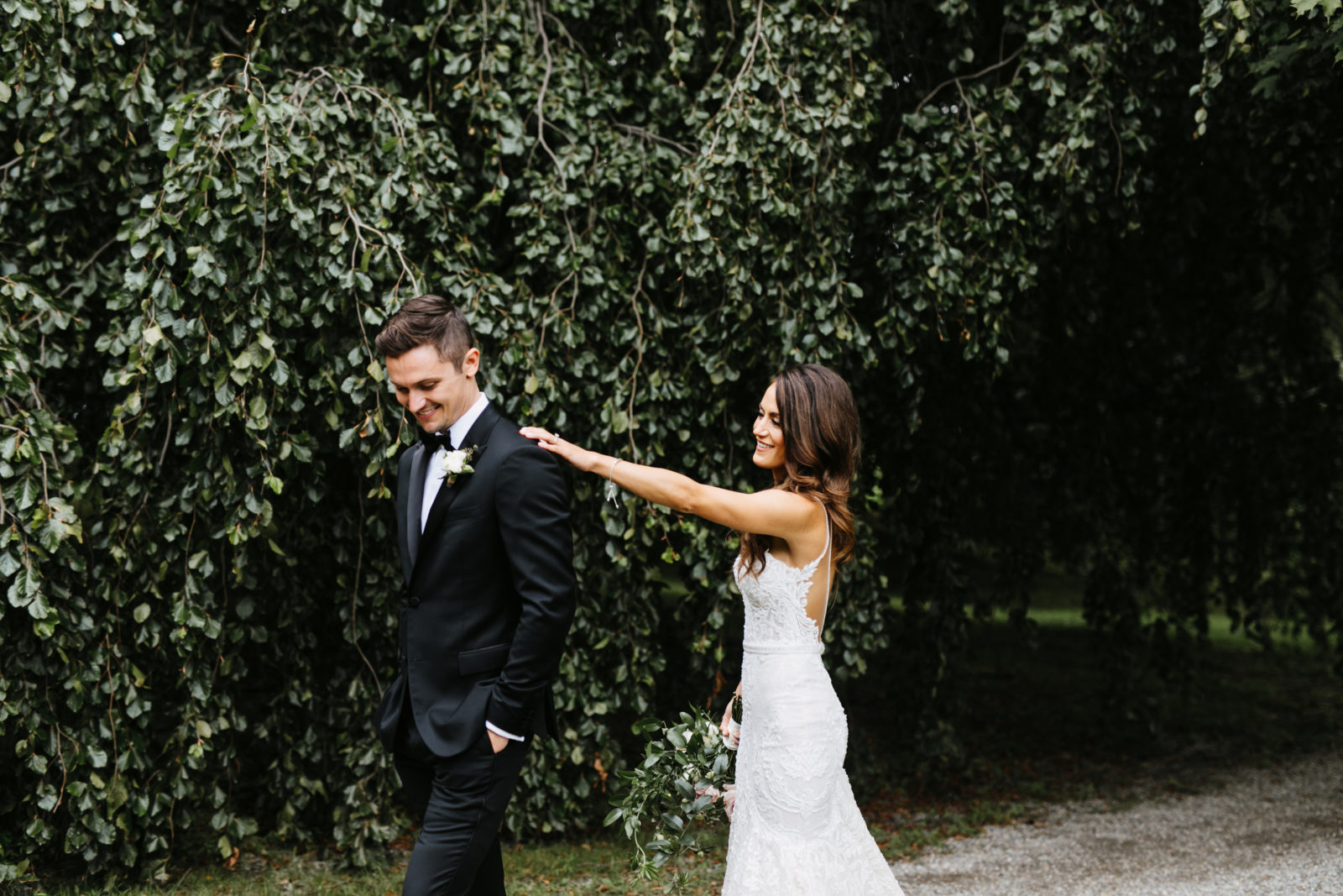 Bride and groom meet in front of weeping beech tree