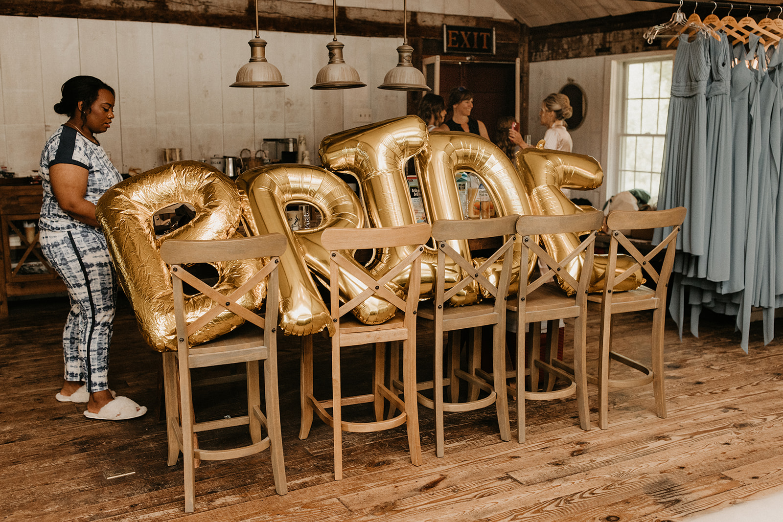 balloons spell out "BRIDE" in bridal suite