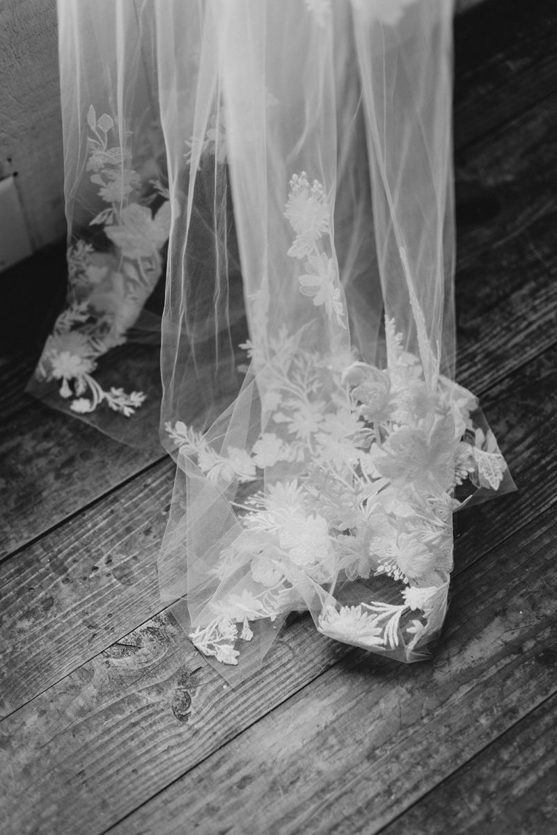 lace from bride's dress falls on the floor