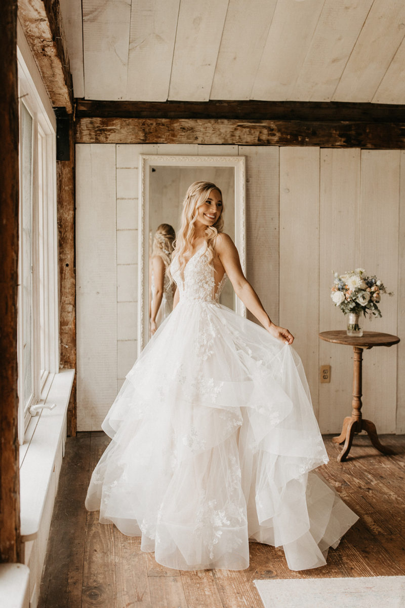Bride poses in her wedding gown