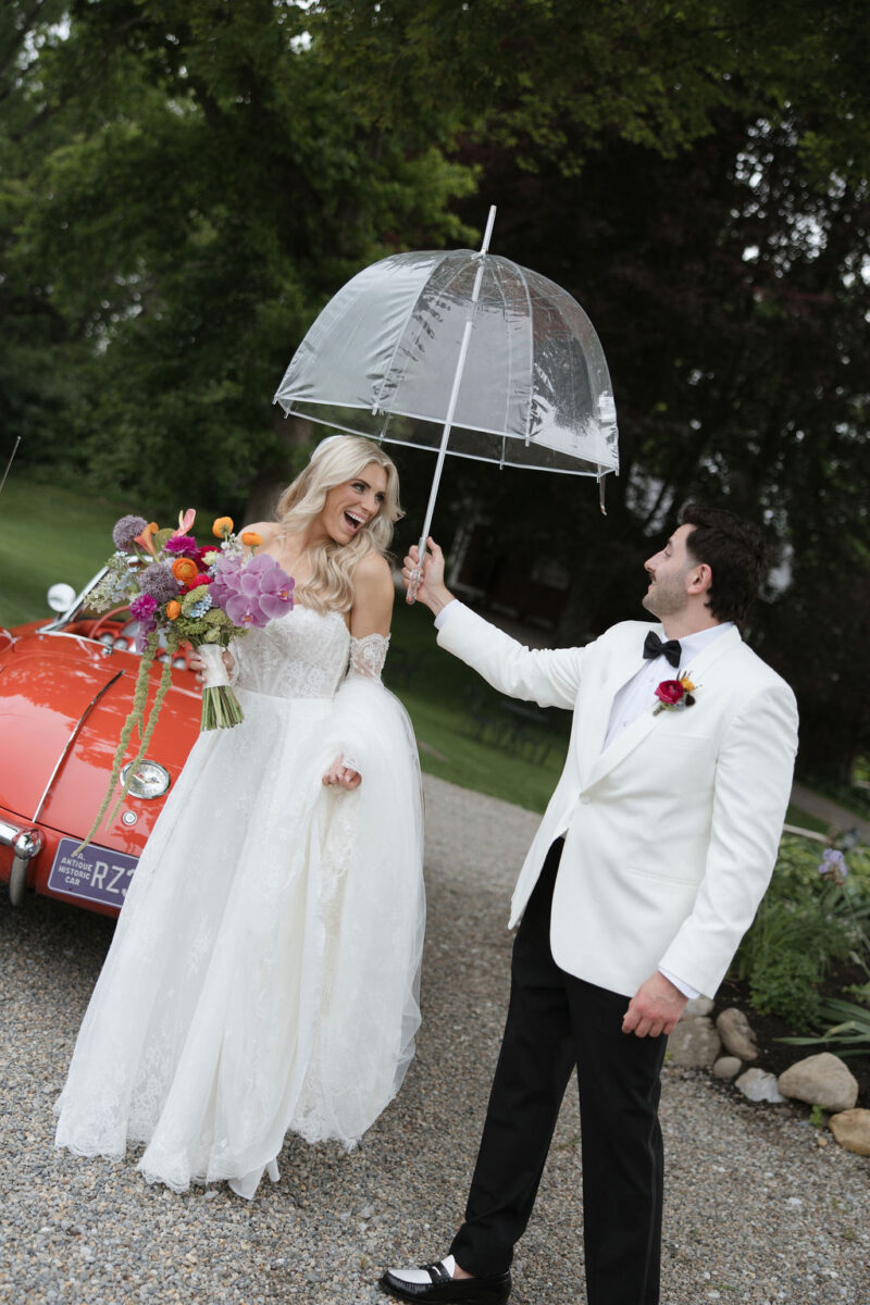 romantic rainy wedding day portraits, bride and groom umbrella