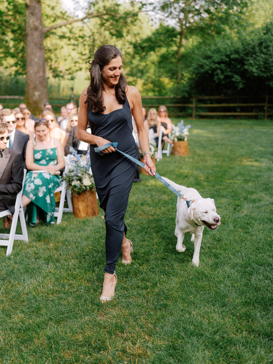 Bridesmaid and dog walking down aisle at pet-friendly wedding venue NJ