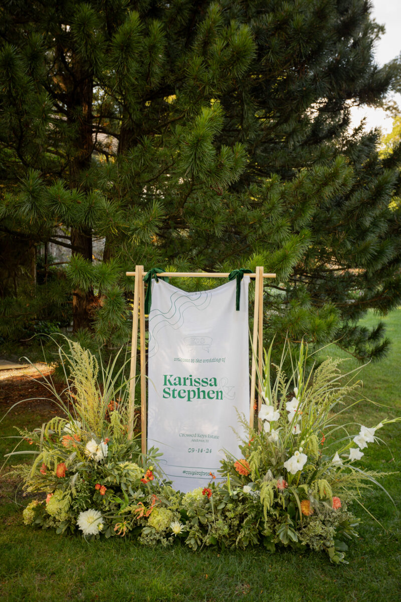 Wedding Signage surrounded with vibrant florals