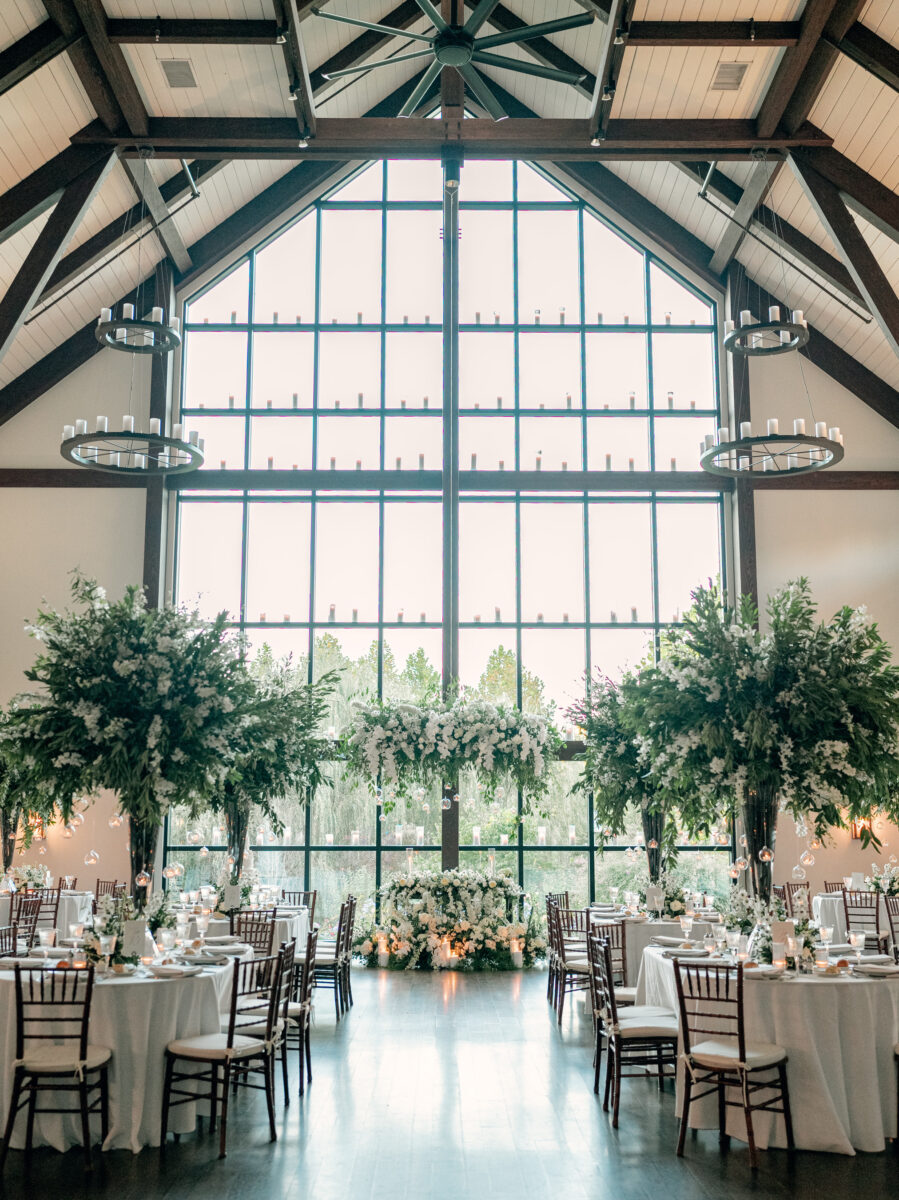 Farmhouse Wedding Reception, 45ft wall of windows. Window Venue Reception, Tall Tree Like Floral Arrangements