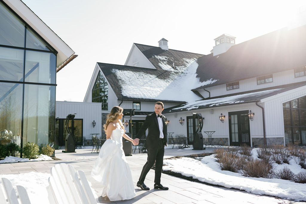 Snowy Farmhouse Wedding, Bride & Groom bracing the chill together for stunning wedding portraits 