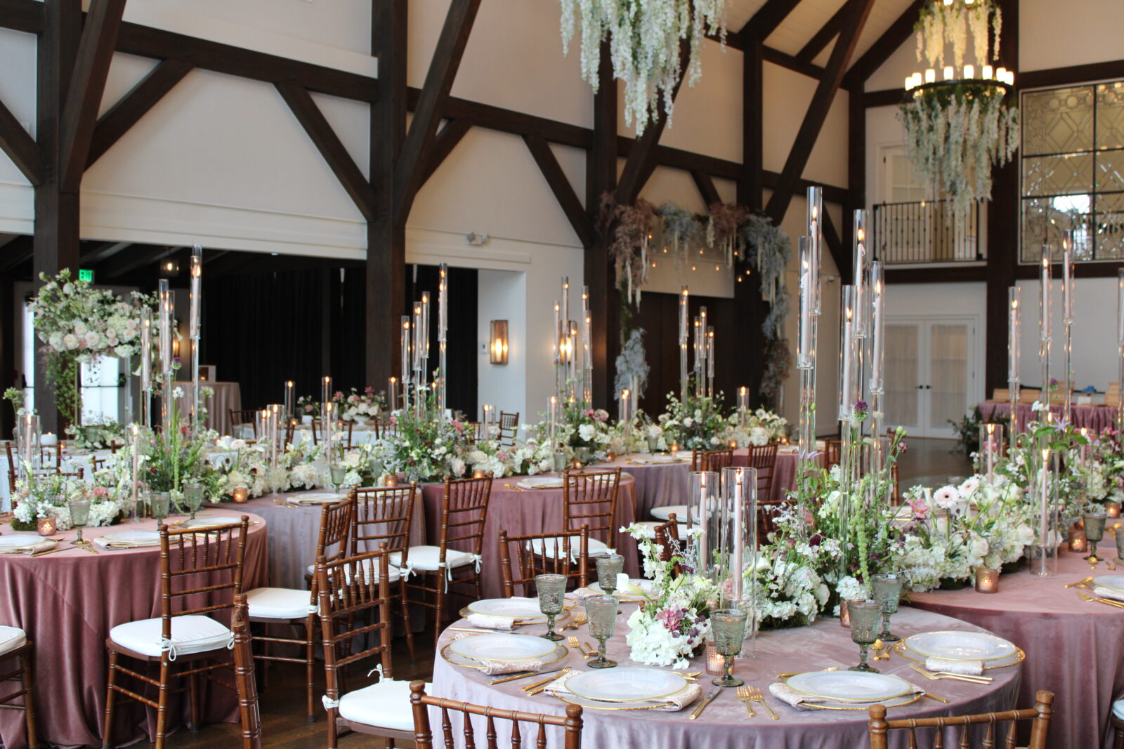 Caterpillar Reception Table Design, Elegant Swan Serenade Wedding Reception Design, Rustic Modern Farmhouse Wedding Venue, Pink Linens, Candelabras