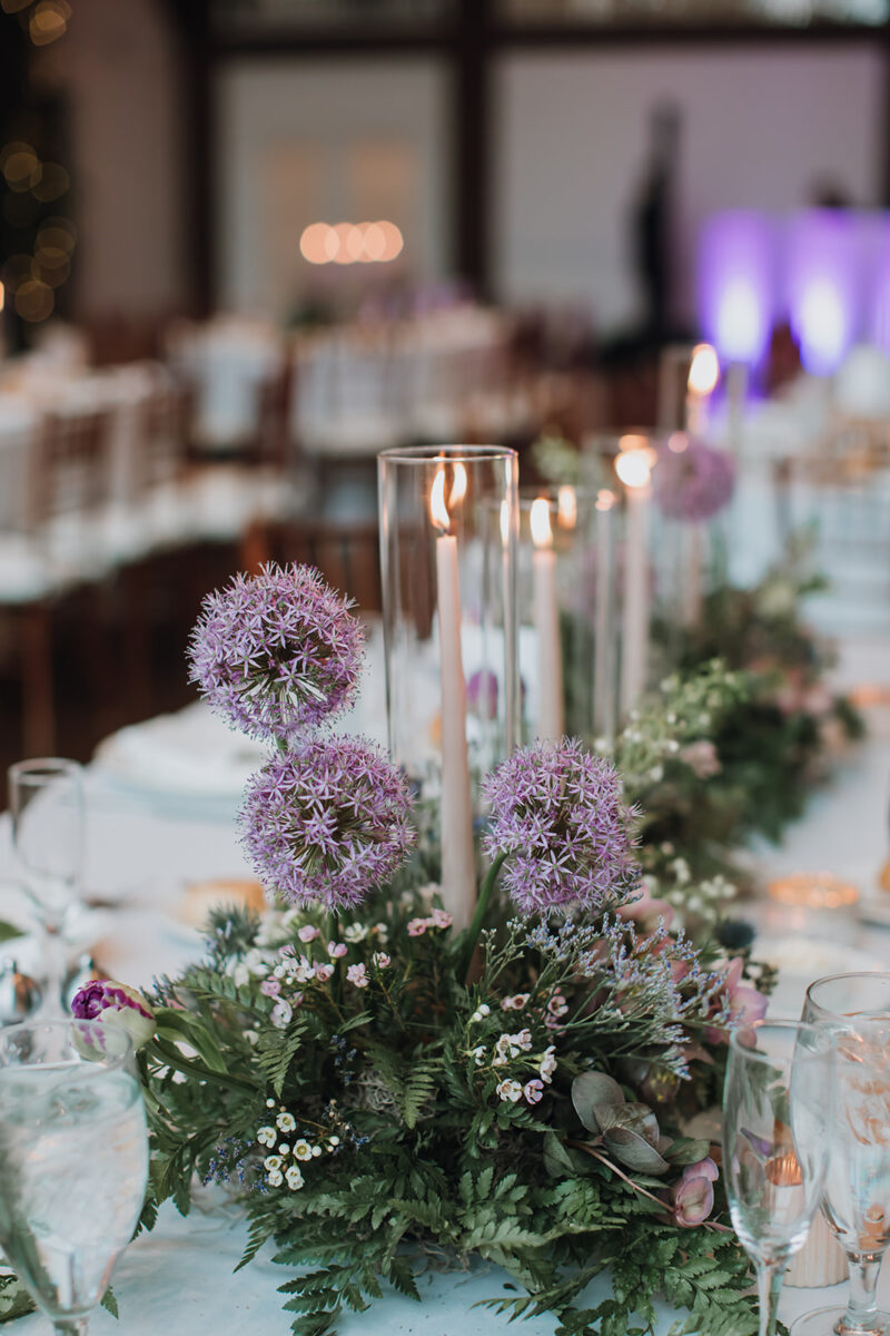 early spring woodland wedding reception centerpiece