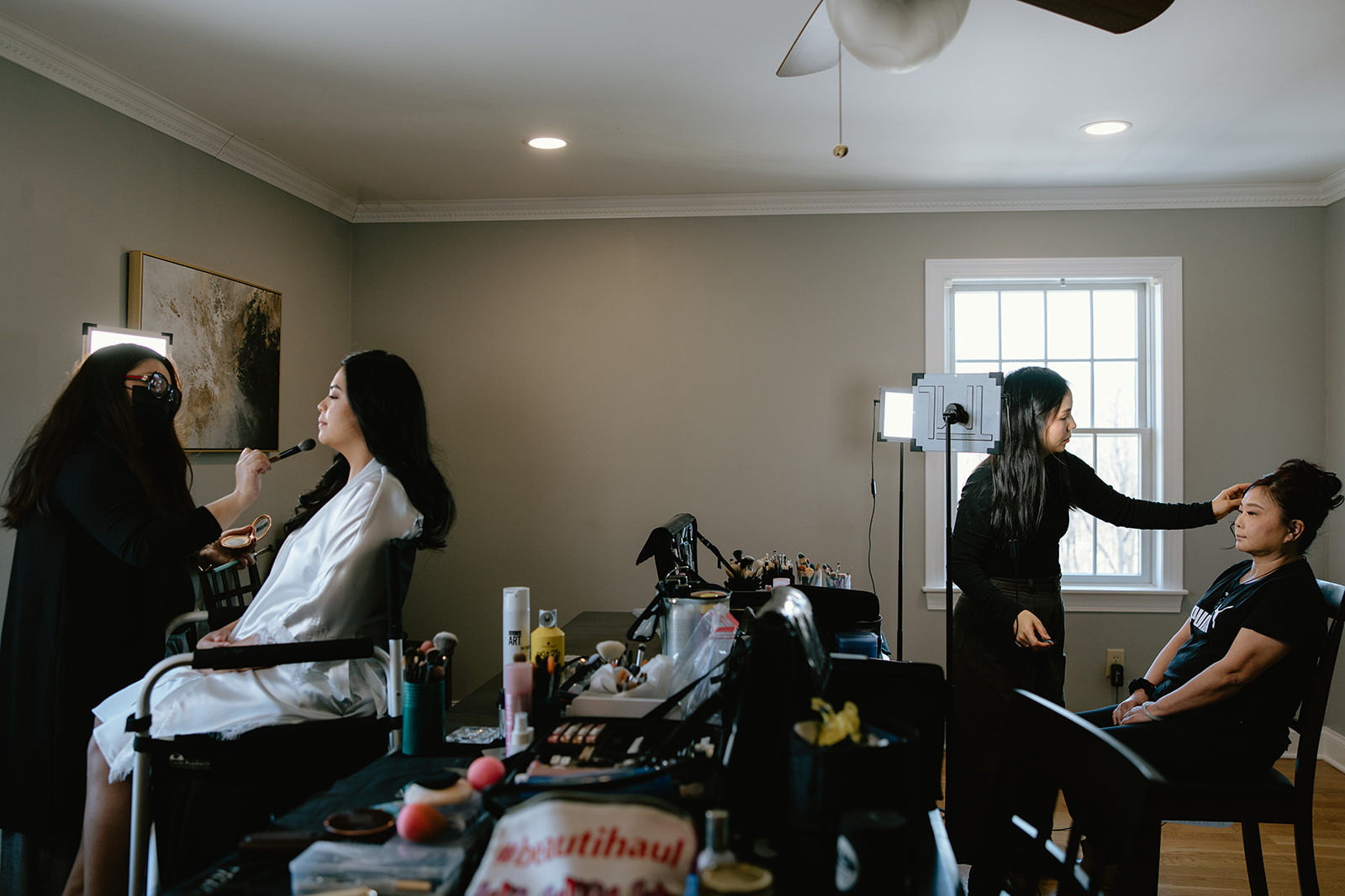 Getting ready with hair and makeup at Crossed Keys Inn before winter wedding ceremony