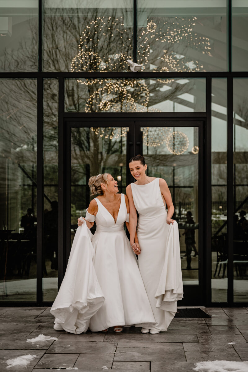 Couple's wedding portraits outside Crossed Keys Estate's glass Conservatory building.
