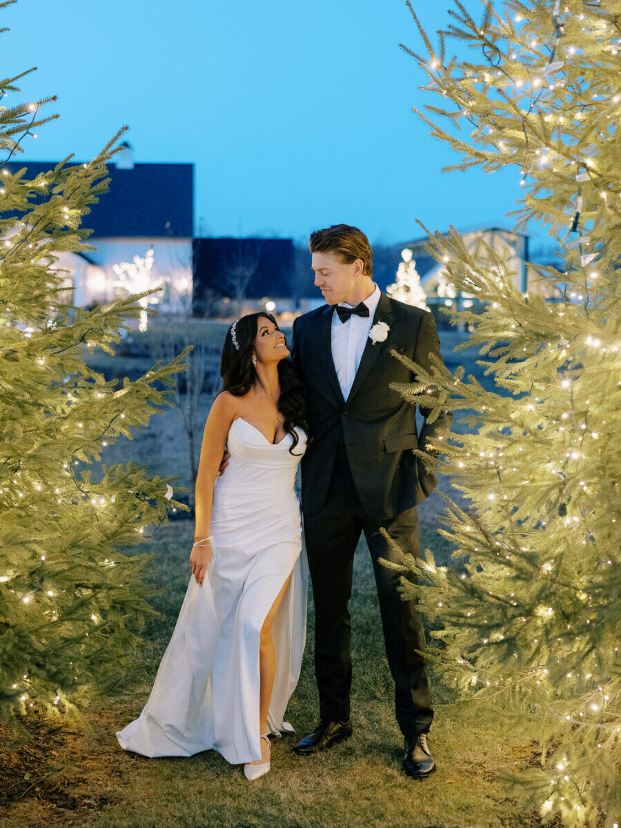 Night Wedding Portraits with Glowing Evergreen Trees, Romantic Winter Wedding Portraits