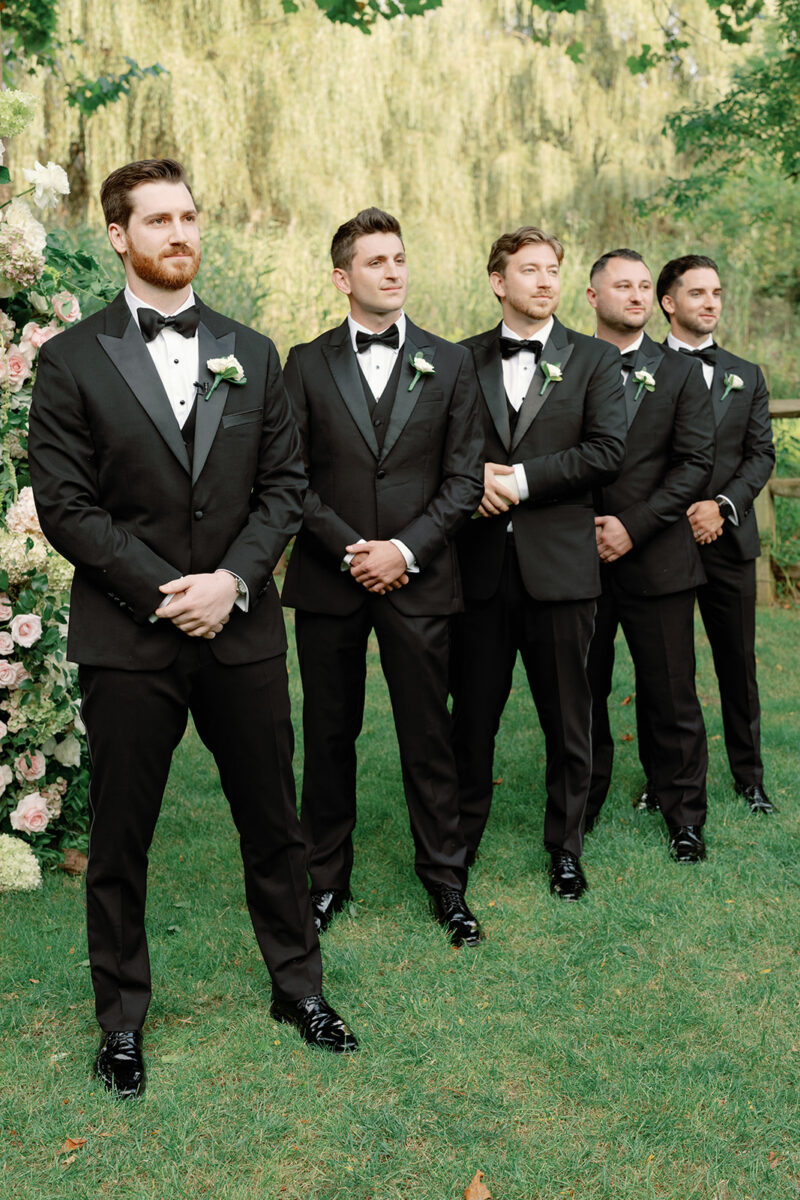 Groom and groomsmen at the alter