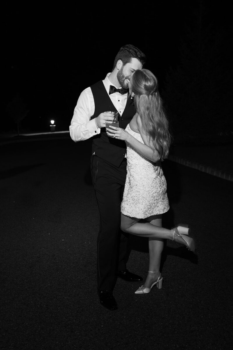 Newlywed couple sneaking away for late night wedding portraits on the grounds at Crossed Keys Estate