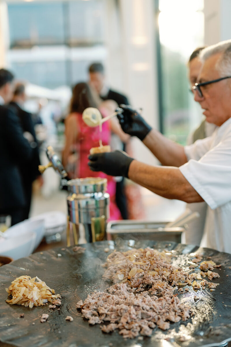 Philly cheesesteak cocktail hour station at upscale New Jersey wedding