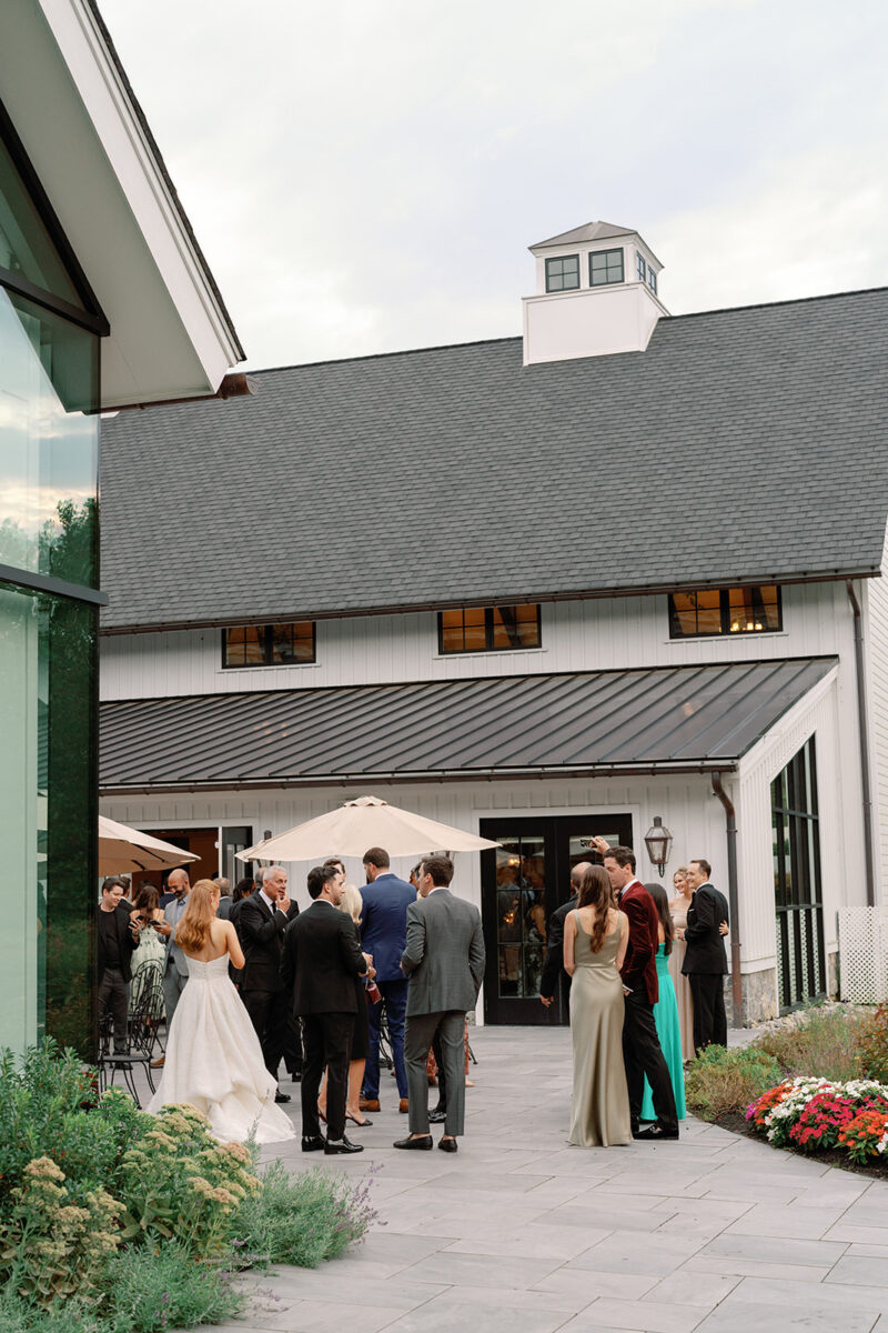 Outdoor cocktail hour on patio with garden views at New Jersey wedding venue
