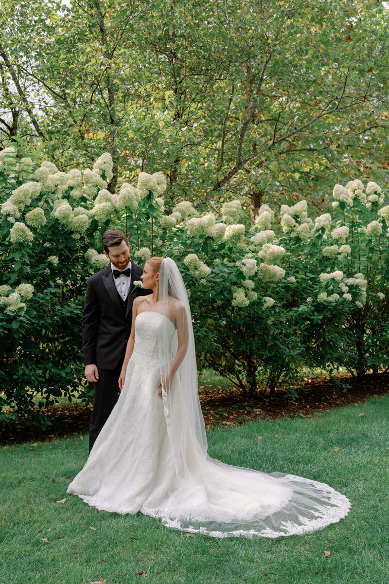 Bride and Groom Portraits with limelight hydrangea bushes in the background at New Jersey estate wedding venue