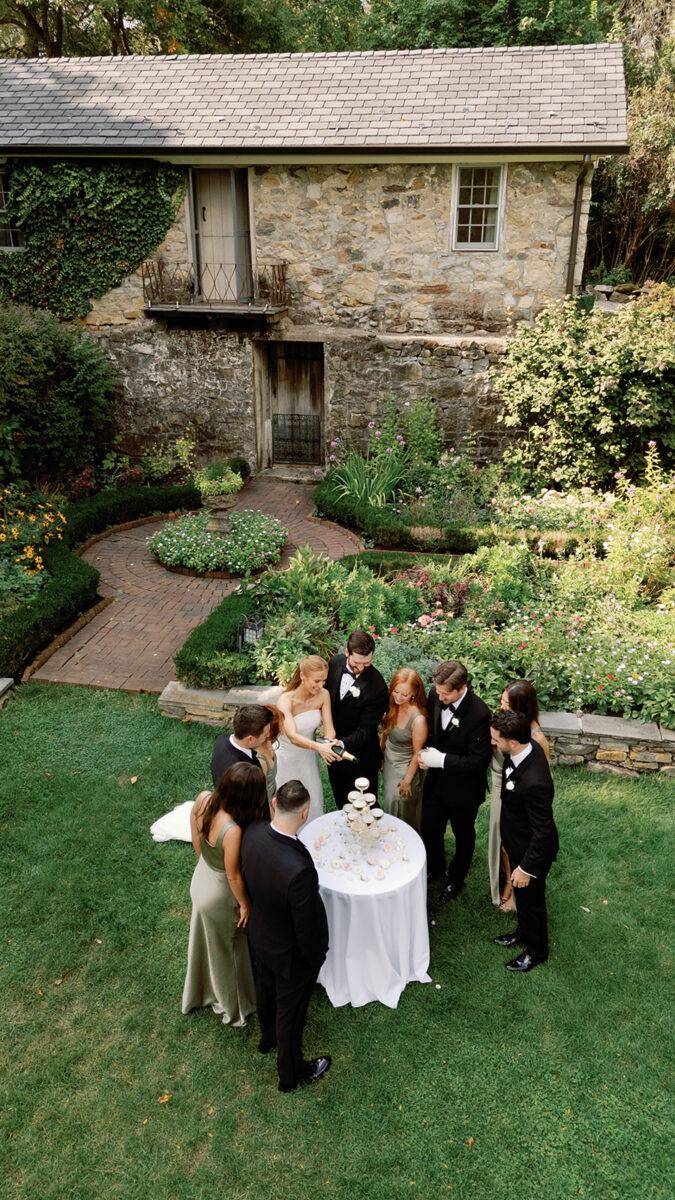 Bridal party champagne toast in the gardens at Crossed Keys Estate