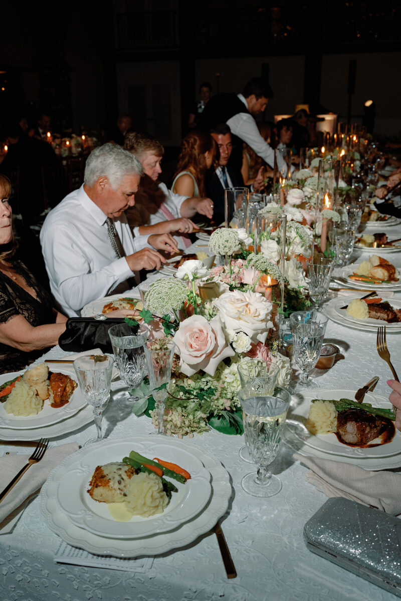 Gourmet catering wedding venue. Dinner service at Crossed Keys Estate. Plated herb-crusted filet of beef entrée at Crossed Keys Estate wedding reception