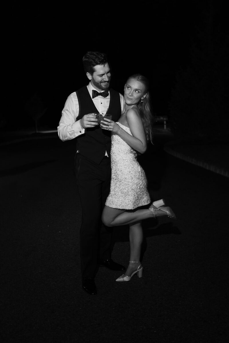 Newlywed couple sneaking away for late night wedding portraits on the grounds at Crossed Keys Estate