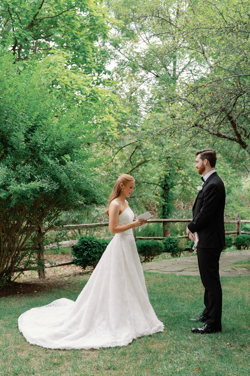 Bride and groom reading private vows at New Jersey garden venue