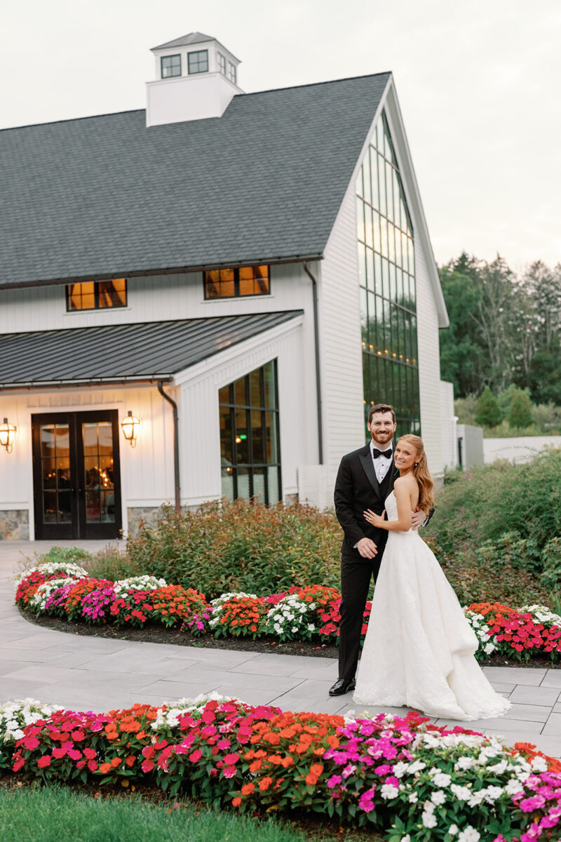 Alyssa and John posing infront of the Farmhouse window. Crossed Keys Estate Luxury Weddings in a Historical Setting