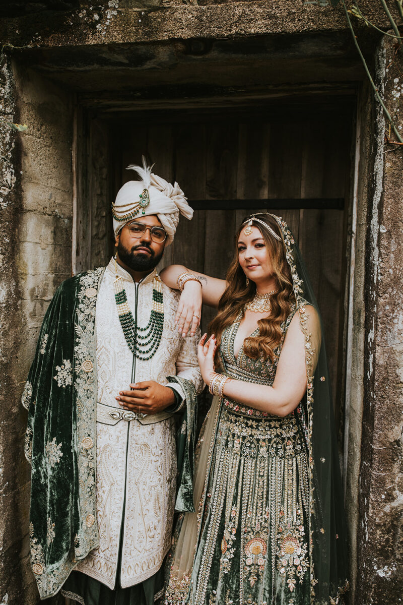 Multicultural wedding couple embracing fall garden setting Crossed Keys Estate