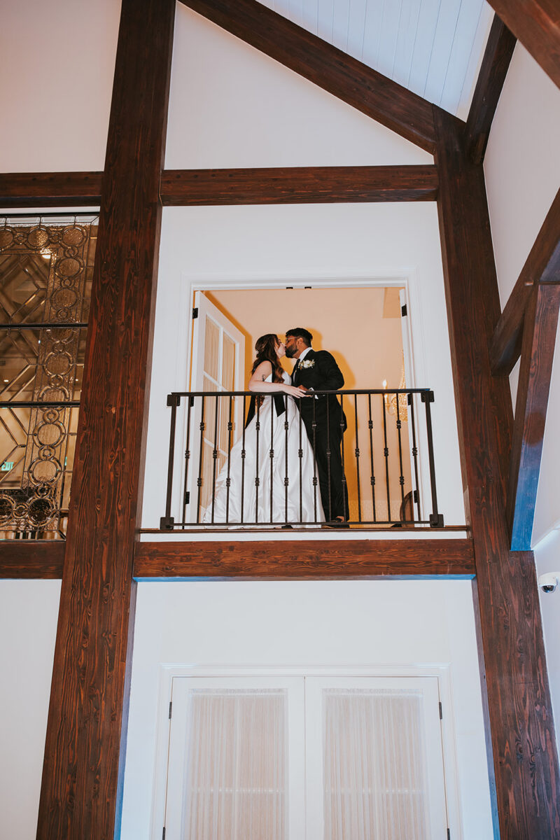 Just married balcony portrait in Crossed Keys Estate's Farmhouse Reception