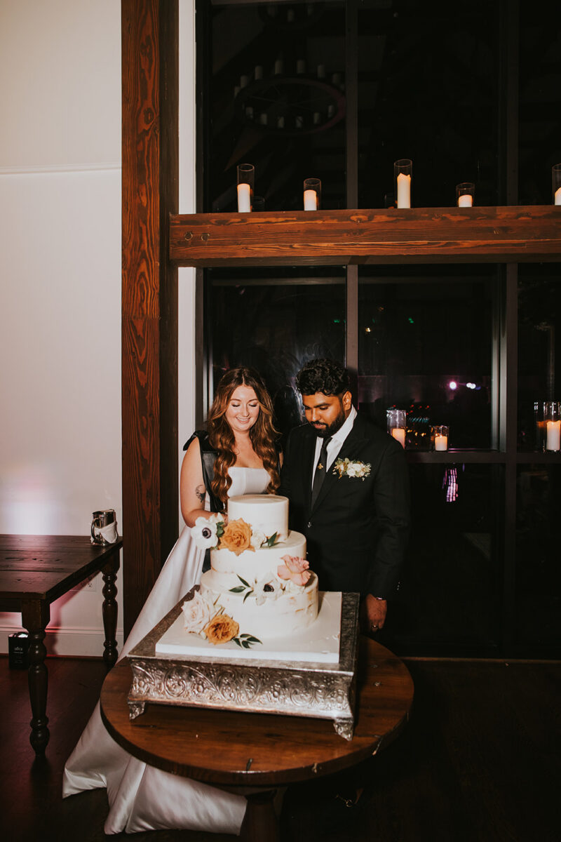 Cake cutting time in Crossed Keys Estate's Modern Luxury Farmhouse